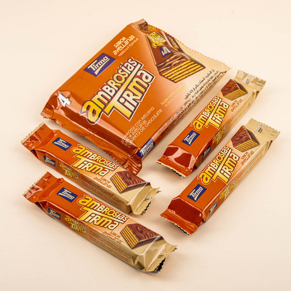 Tirma Snack Pack of 4 wafers filled with hazelnut cream and dipped in milk chocolate showing the pack of 4 and individual wafers.