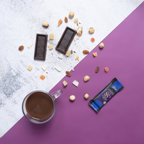 Tirma Mini 85% Dark Chocolate Bars 180 g open with the 2 mini with a cup of chocolate. Spanish mini dark chocolate made in Spain.
