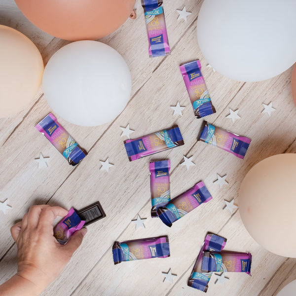 Tirma Mini 50% Milk Chocolate Bars, 30% Less Sugars 180 g. 10 mini chocolate bars with baloons and stars. Spanish mini milk chocolate bars made in Spain