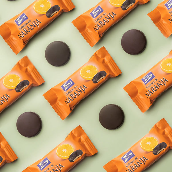 9 Tirma Orange Biscuits covered in 70% Dark Chocolate arranged with 4 chocolate orange biscuits. Spanish orange chocolate biscuit made in Spain.