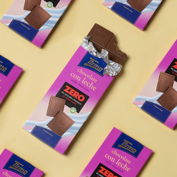7 Tirma Zero Milk Chocolate Bar with No Added Sugars, 125g. Gluten Free chocolate on a yellow background. Spanish chocolate made in Spain.
