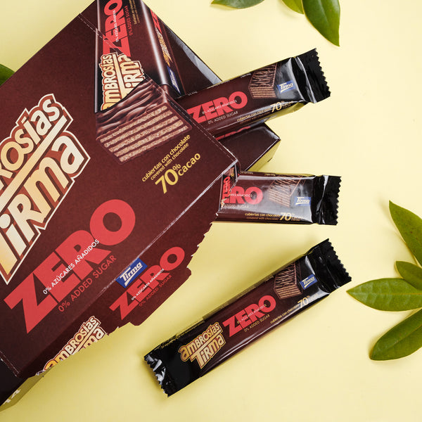 Tirma 70% Dark Chocolate Wafers coming out of 301g box. Placed on a yellow background with green leaves. Tirma's Chocolate Wafers Photography. Spanish wafers in the UK