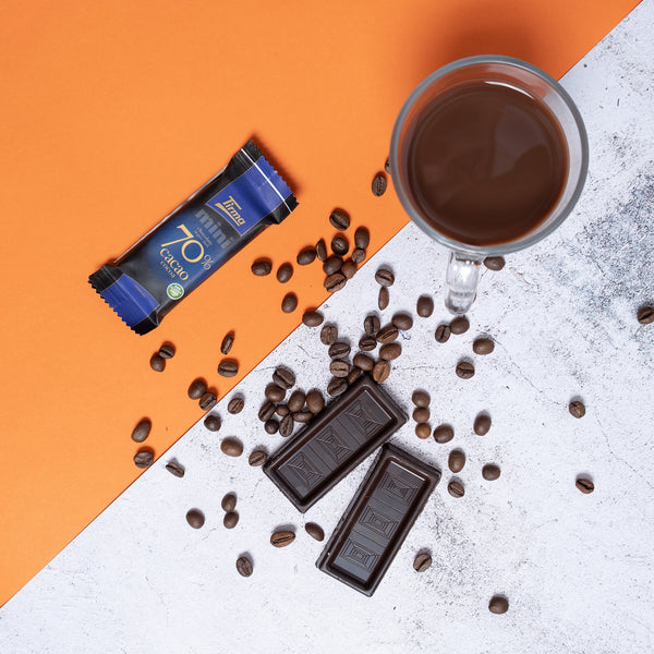 Tirma Mini Dark Chocolate Bars - 70% Chocolate 2 opened chocolate with scattered cacao beans. Spanish mini chocolate bar made in Spain.