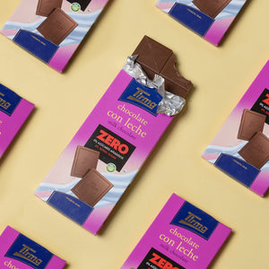 7 Tirma Zero Milk Chocolate Bar with No Added Sugars, 125g. Gluten Free chocolate on a yellow background. Spanish chocolate made in Spain.