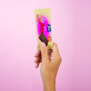 Tirma's Snack BeZero Milk Chocolate Biscuits 105 g with a hand holding it. Spanish biscuits made in Spain.