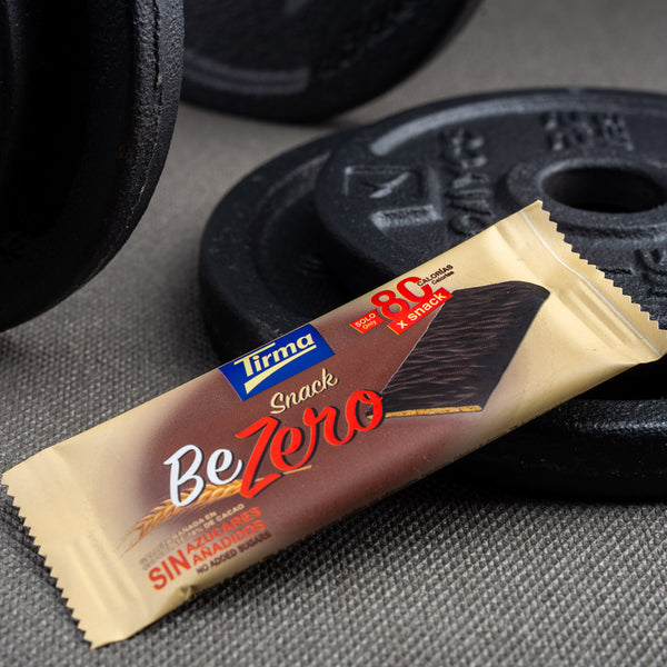 Tirma Snack Be Zero 70% dark chocolate biscuit bar individually wrapped and placed on weights. A healthy snack after your work out. Spanish biscuit made in Spain.
