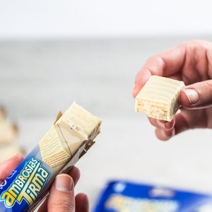 Tirma White Chocolate Wafers unwrapped and broken in half to display the wafer which is cream filled inside covered in white chocolate.